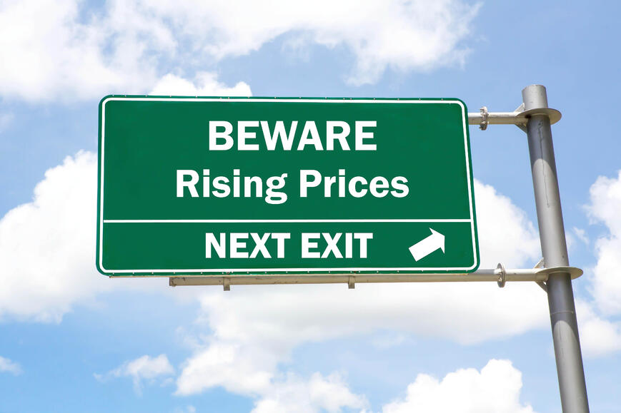 Rising prices ahead road sign